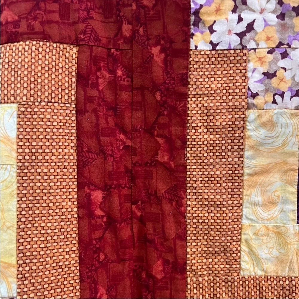 Hand crafted yellow square and floral quilt